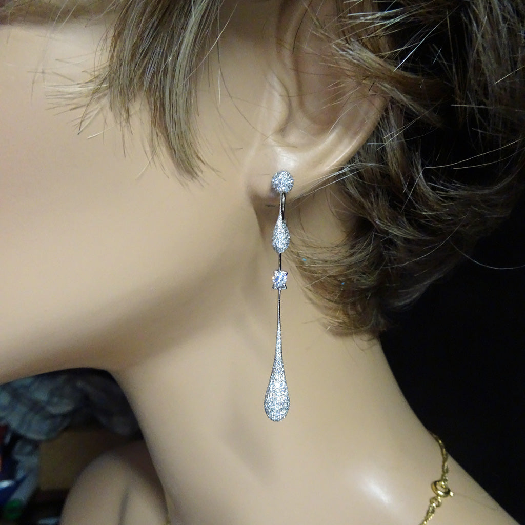 model wearing Chopard earrings diamonds 18k gold long ear pendants vintage estate jewelry